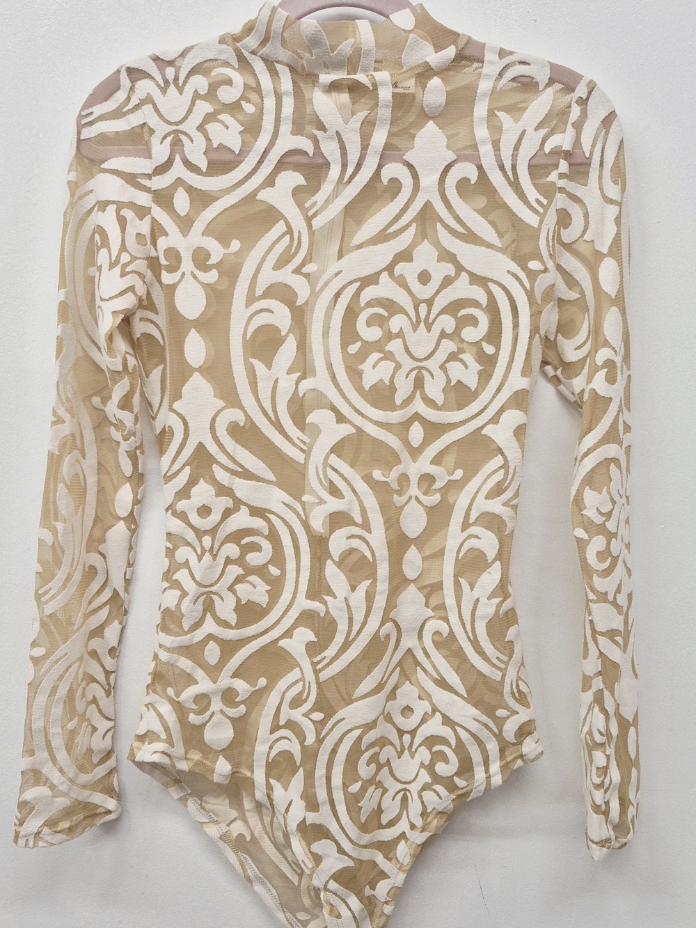 Beige sheer long-sleeve bodysuit featuring a cream-colored velvet damask print